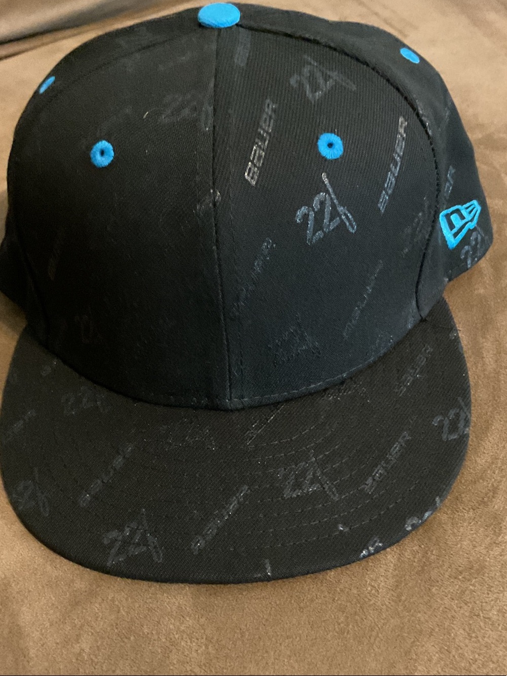 New Era Black and Blue Snapback Hat with Subtle Logo Print